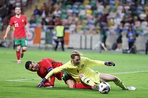 Cristiano Ronaldo fight for the ball with Ireland's goalkeeper